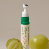 Vegan Collagen Eye serum with grapes on a beige background