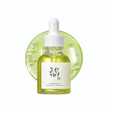 Beauty of Joseon Calming Serum green dropper bottle on reflective surface