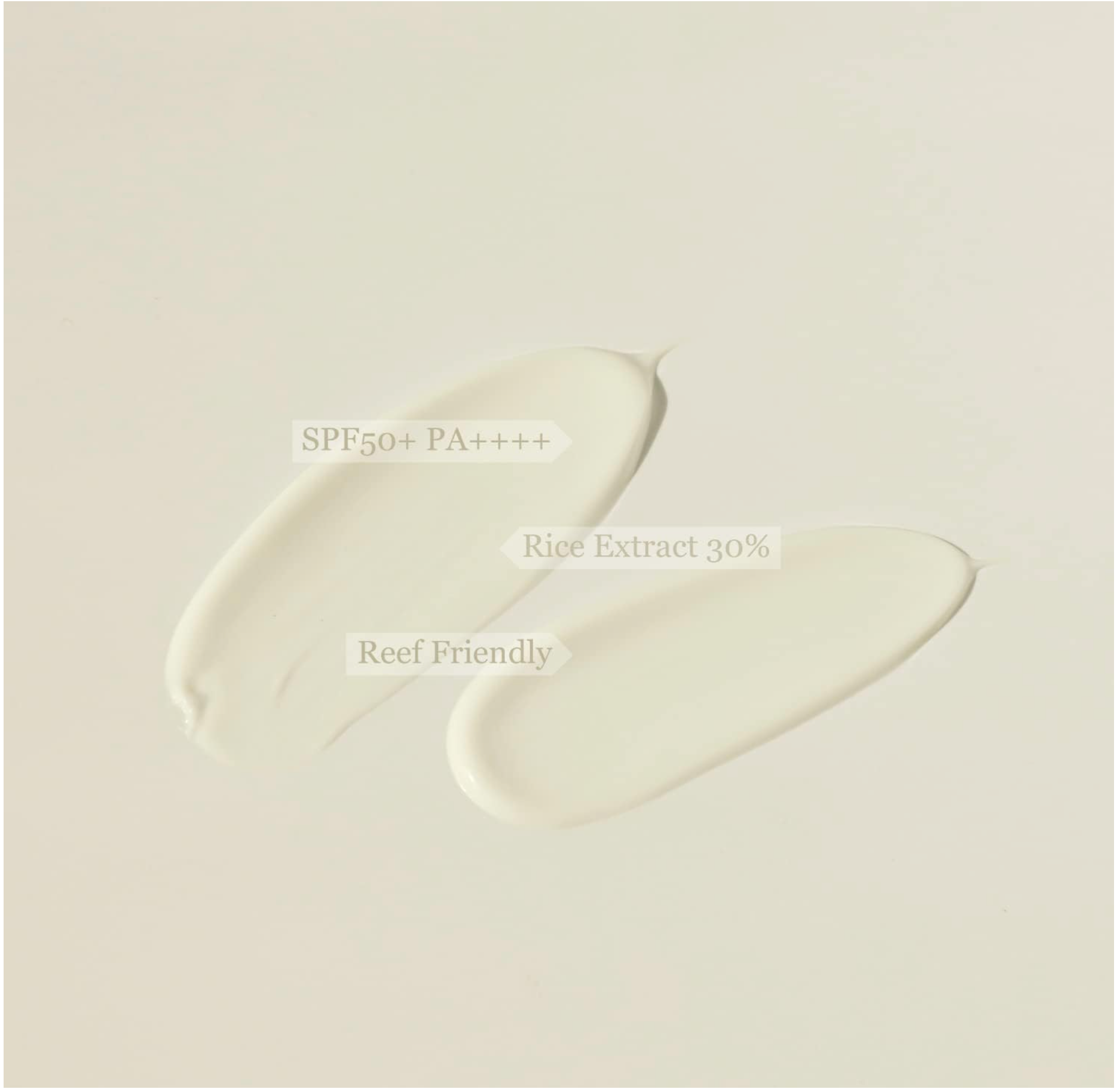 Two swatches of a cream product on a light beige background with text indicating SPF, PA rating, and rice extract content.