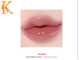 Lip with glossy lip tint labeled 'Not Bad' and color '#11 Baddle Beige'.