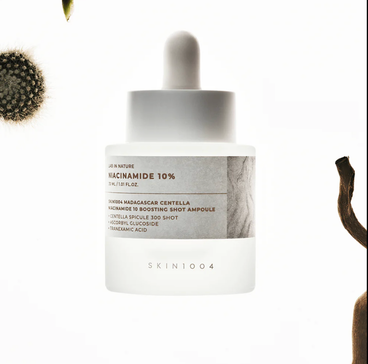 SKIN1004 Niacinamide 10 Boosting Ampoule 30ml white dropper bottle on grey background